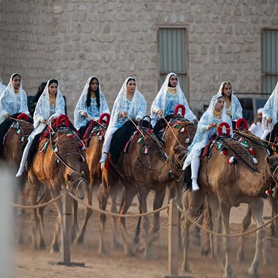 emirati-women-traditional-camel-parade