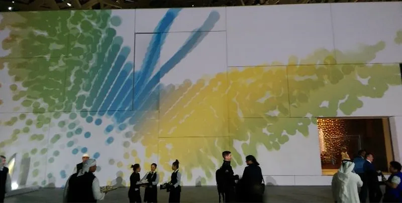ADSW and ZFEP gala reception at Louvre Abu Dhabi with large-scale projection graphics and guest networking