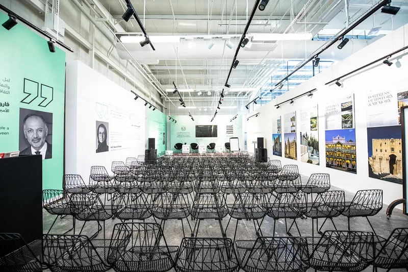 Al Burda Festival conference room with theatre seating, exhibition displays and presentation stage in Abu Dhabi