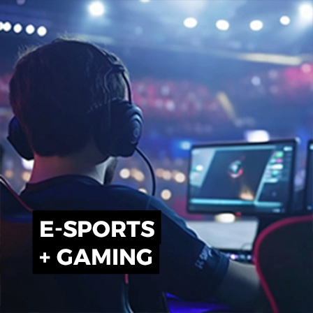 E-sports gaming event with player headset, competition screens and live technical production