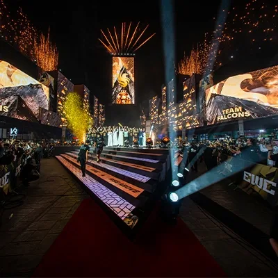 Esports World Cup 2025 live event stage with audience walkway, branded screens and pyrotechnic effects