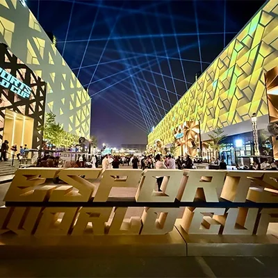 Esports World Cup 2025 outdoor venue with illuminated façades, branded structures and public event spaces
