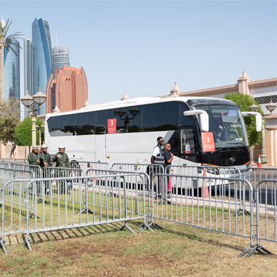Event shuttle bus and managed guest transport arrival area