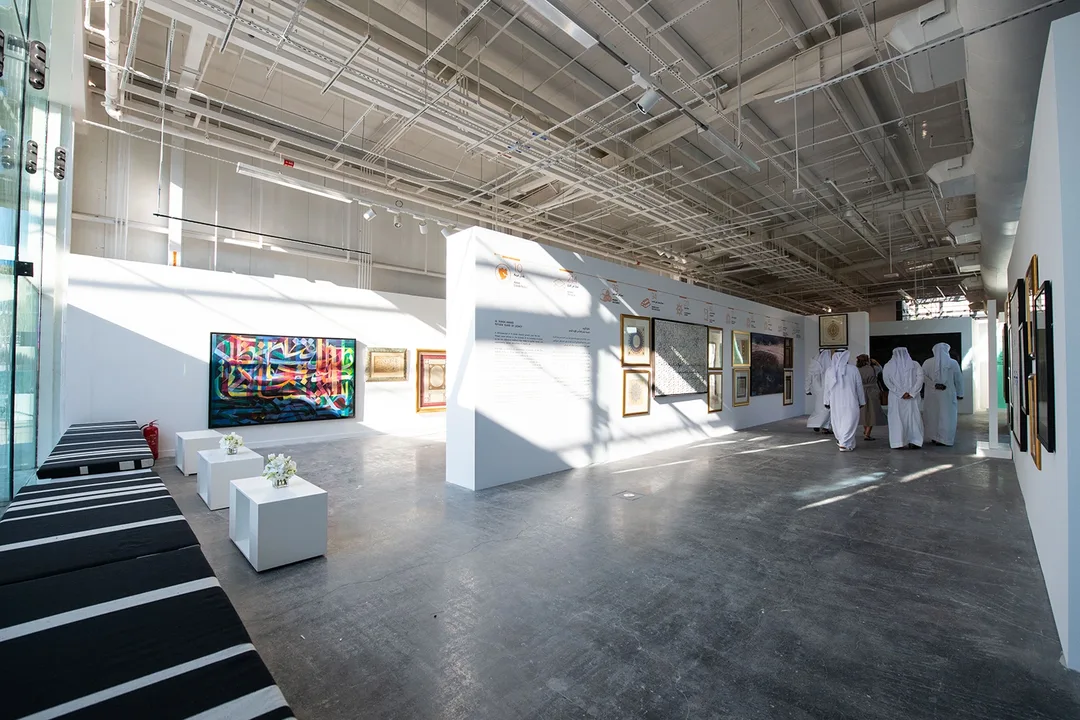Al Burda Festival art gallery with contemporary Islamic artworks, custom exhibition walls and guest seating