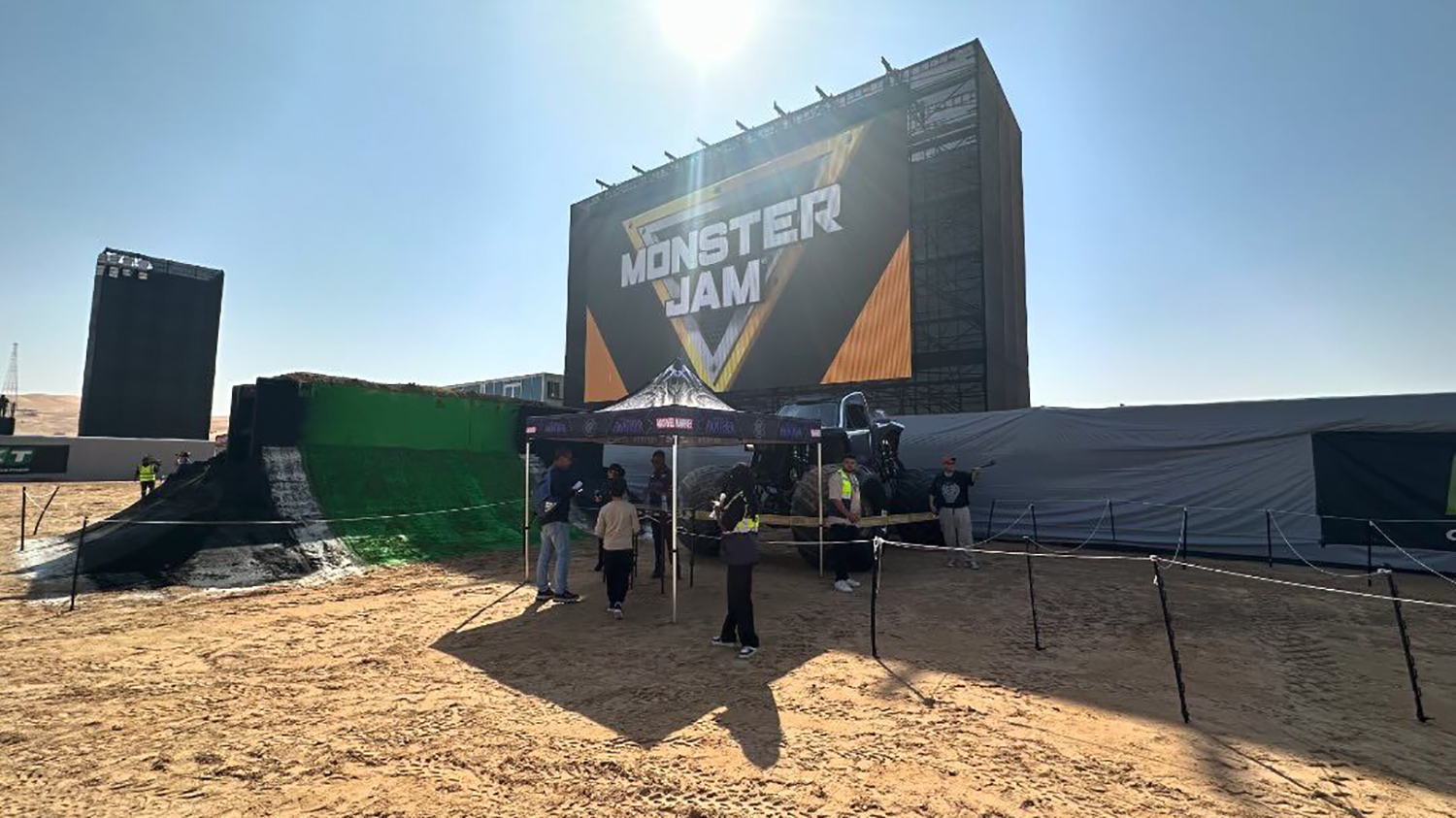 Monster Jam Liwa desert event with temporary grandstands, lighting, infrastructure and large-scale site production