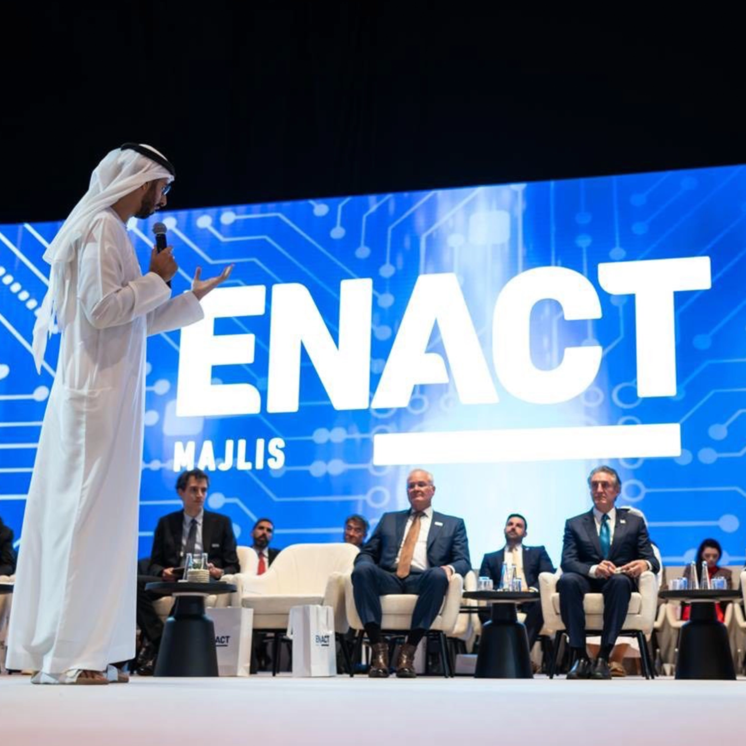 ENACT Majlis discussion with speaker addressing seated delegates in a formal hospitality setting