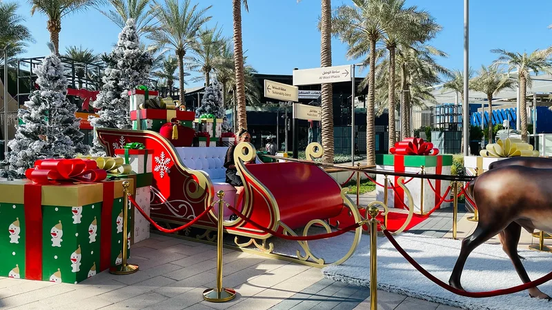 Santa sleigh installation at Expo 2020 Dubai with festive scenic design, oversized gifts and guest photo opportunity