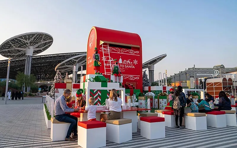 Festive Christmas retail and guest activation at Expo 2020 Dubai with themed kiosks, seating and seasonal branding