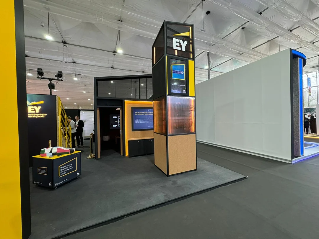Finished EY exhibition environment at COP28 Dubai with integrated scenic design, digital content and lighting