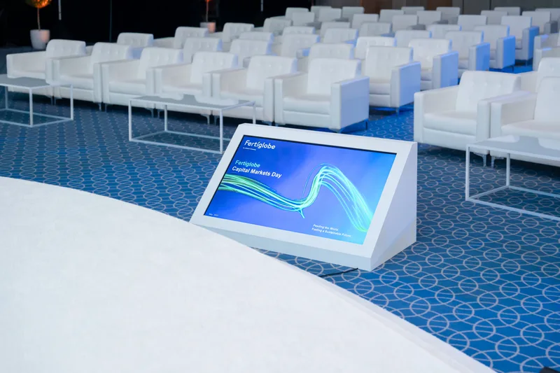 Presenter comfort monitor positioned in front of the Fertiglobe Capital Markets Day stage with delegate seating behind