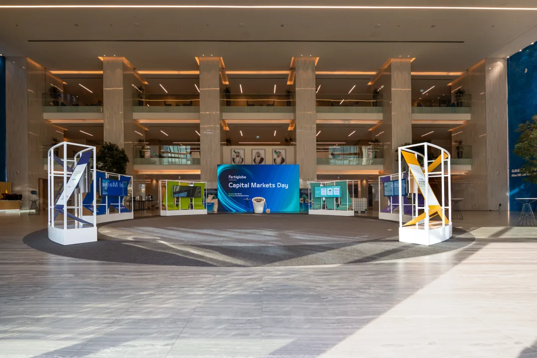 Fertiglobe Capital Markets Day exhibition and registration area with branded displays, interactive screens and event wayfinding