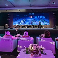 Global Citizen Forum conference presentation with large digital screen, executive seating and live audience