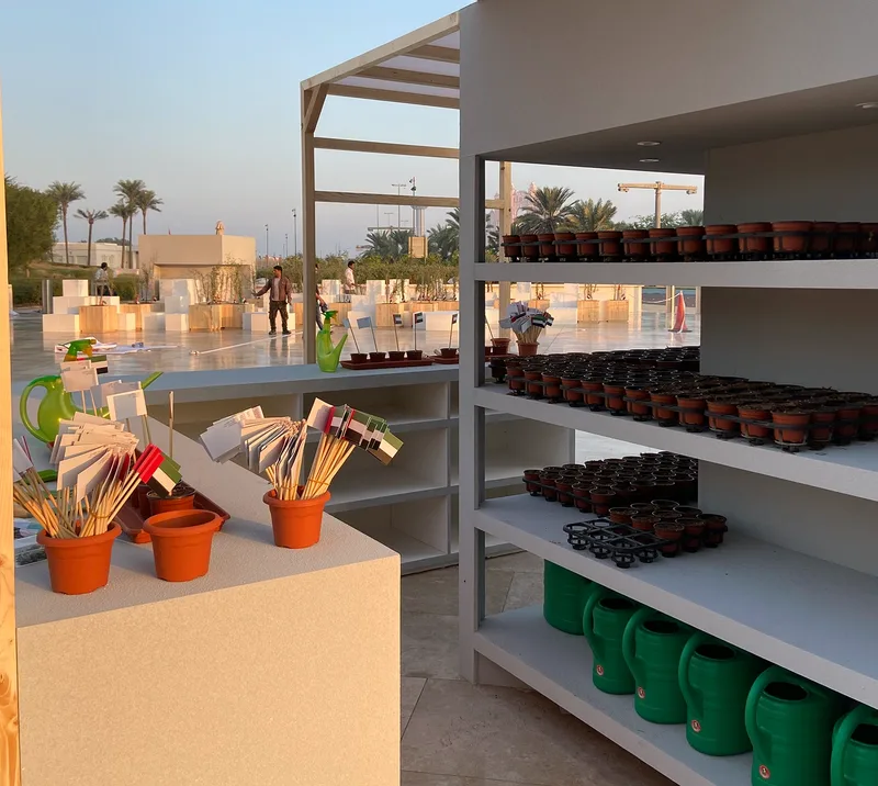 Interactive planting station at the Founder’s Memorial activation with seedlings, pots and guest activity materials