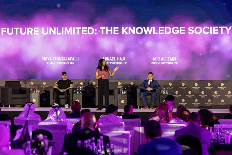 Global Citizen Forum panel discussion with speakers on stage and seated delegates in Ras Al Khaimah