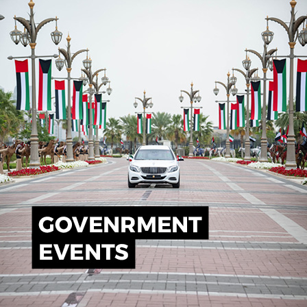 Official government motorcade route in the UAE with national flags, ceremonial streetscape and event protocol