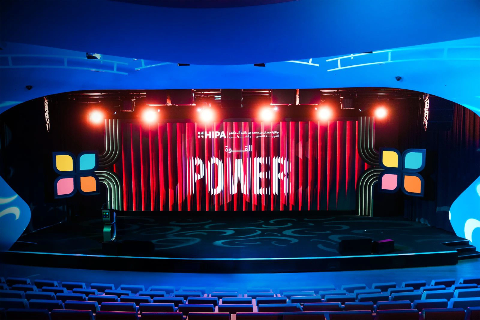 Evolution Technical dynamic stage lighting rig casting vivid spotlight arrays across set