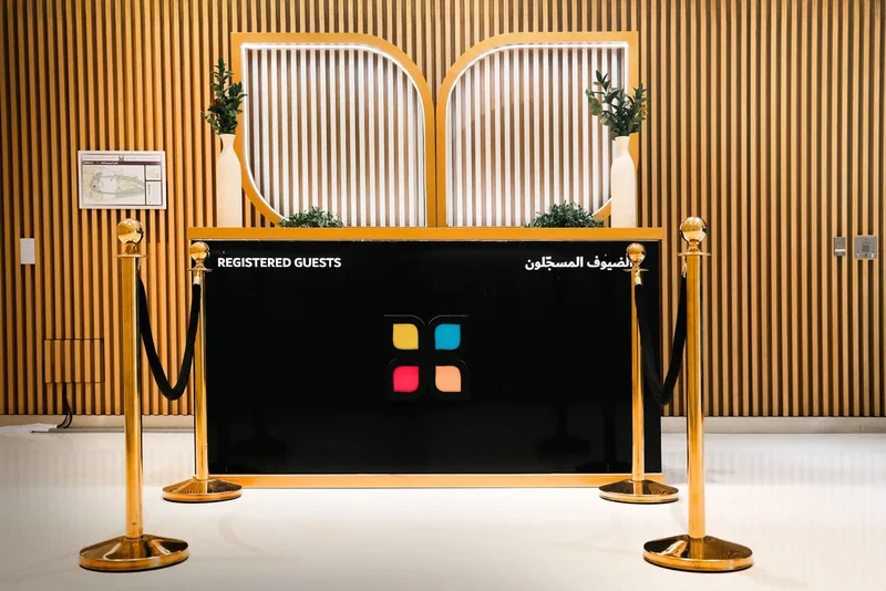Branded guest registration desk at a HIPA event