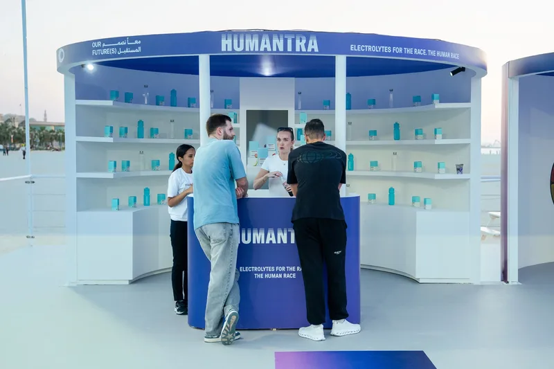 Visitors exploring the Humantra wellbeing display within the Our Future(s) activation