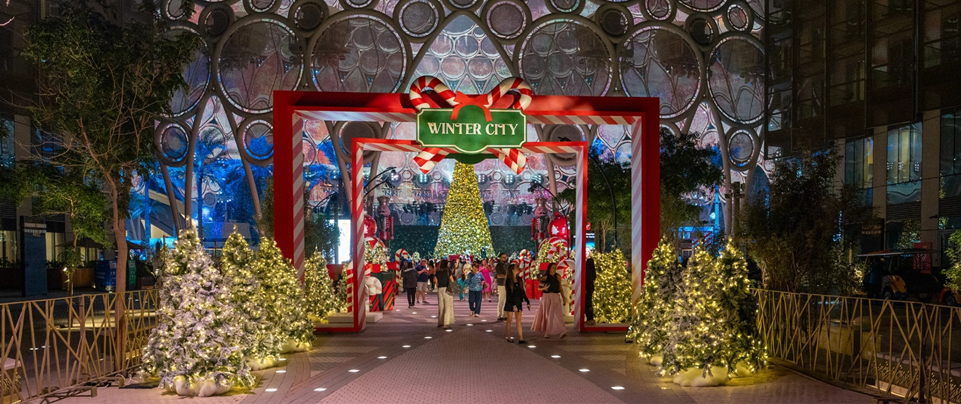 Visitors entering Winter City through illuminated red and white festive frames