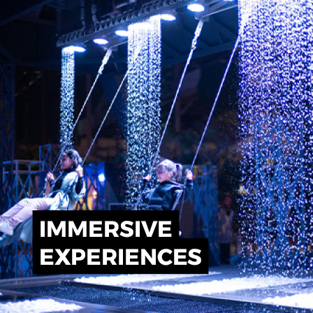 Immersive live performance with water effects, theatrical lighting and large-scale scenic production