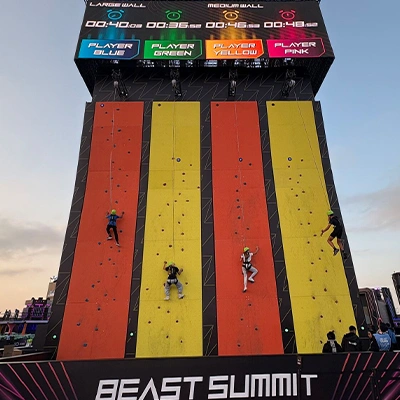 Interactive climbing wall experience at a public event activation