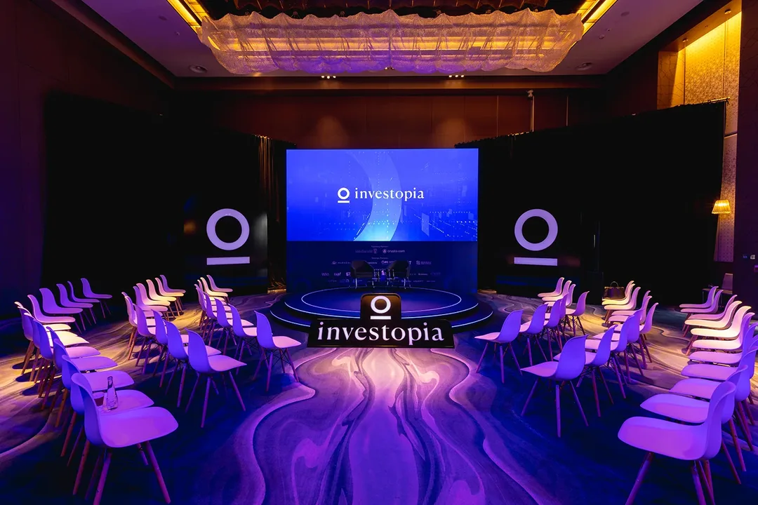 Investopia conference stage with large LED screens, lighting and technical production in Abu Dhabi