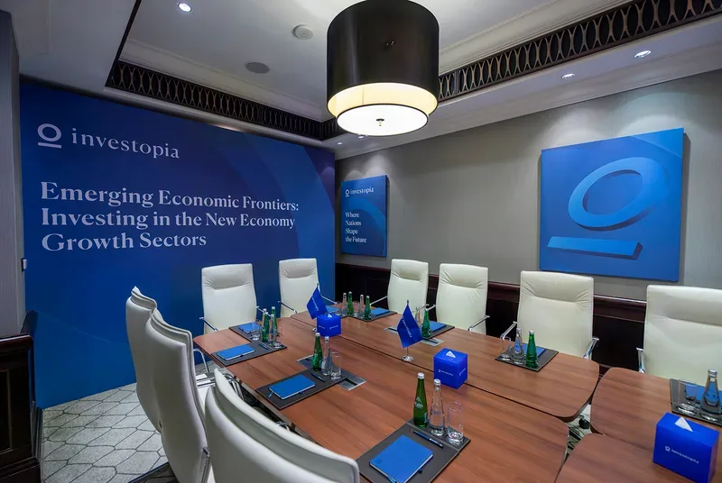 Evolution Scenic Future 100 conference stage with curved LED screen, podium and delegate seating