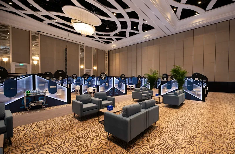 Evolution Scenic Investopia business meeting area with illuminated private booths and lounge seating