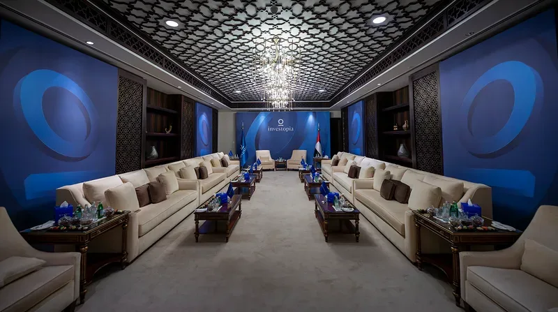 Evolution Furniture Investopia VIP majlis with formal lounge seating, branded walls and national flags