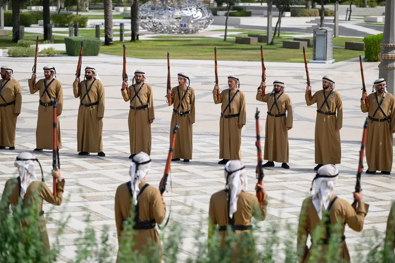 Emirati ceremonial guards holding rifles during an official state reception for the Republic of Korea in Abu Dhabi