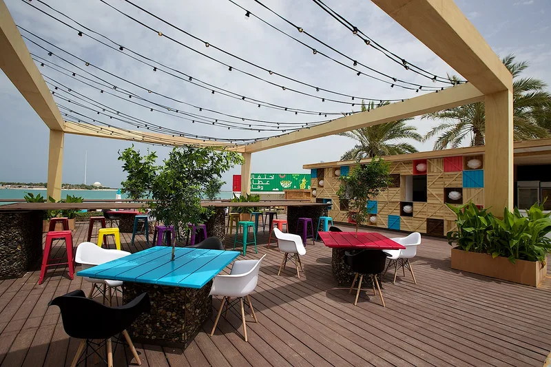 Mother of the Nation Festival outdoor hospitality area with colourful furniture, shade structures and guest seating