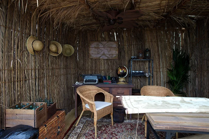 Rustic themed interior at Mother of the Nation Festival with traditional materials, furniture and cultural décor