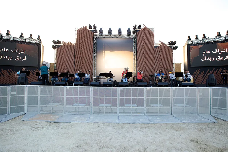 Mother of the Nation Festival live performance stage with temporary scenic structure, audience barriers and event infrastructure