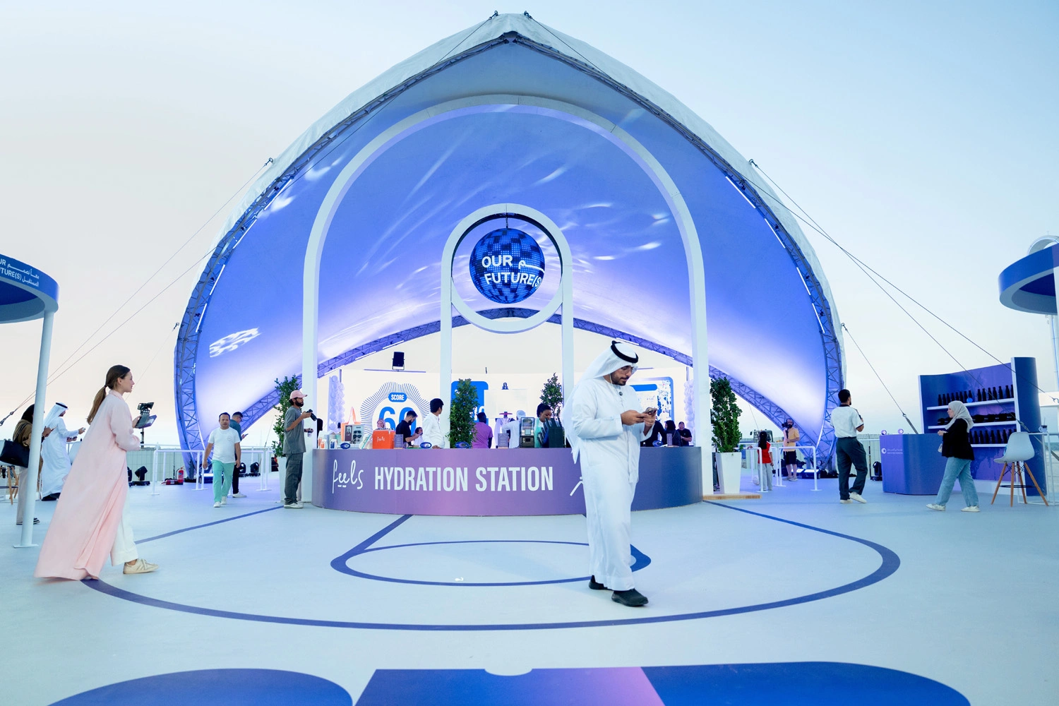 Wide-angle view of main plenary auditorium filled with tech visionaries during Dubai summit