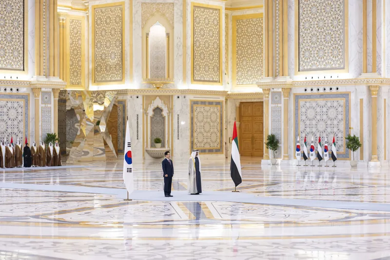 South Korean and UAE officials standing inside a formal ceremonial hall during an official state visit in Abu Dhabi