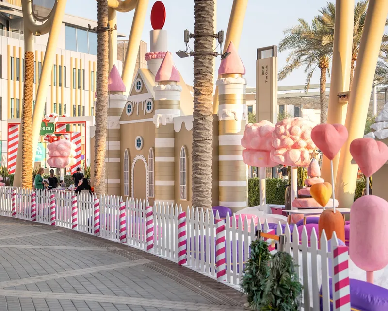 Sugar Plum Land castle with pastel candy trees and striped picket fencing