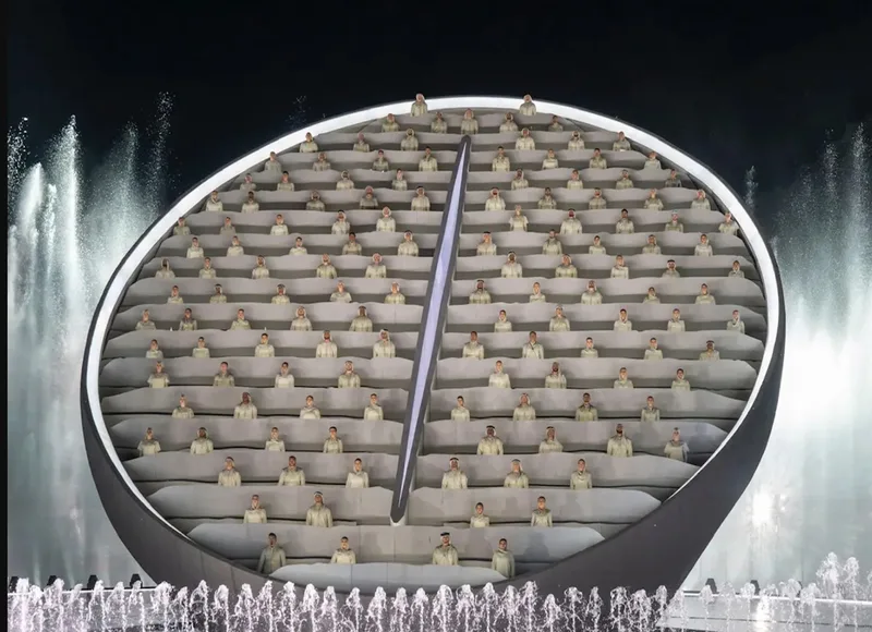 Large-scale UAE 50th National Day scenic structure with tiered illuminated elements and live performers