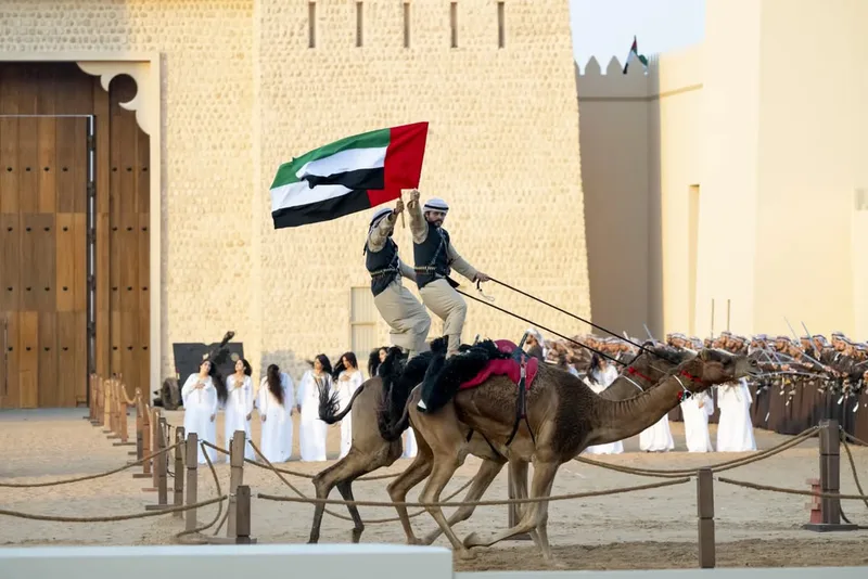 Union Parade 2025 in Abu Dhabi with mounted rider carrying the UAE flag during a traditional ceremonial procession