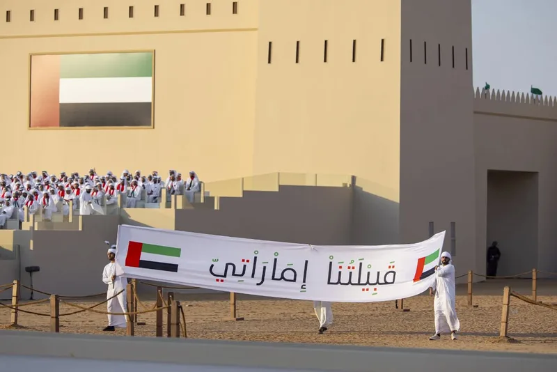 Union Parade 2025 scenic installation with UAE-themed branding and performers at the national celebration in Abu Dhabi