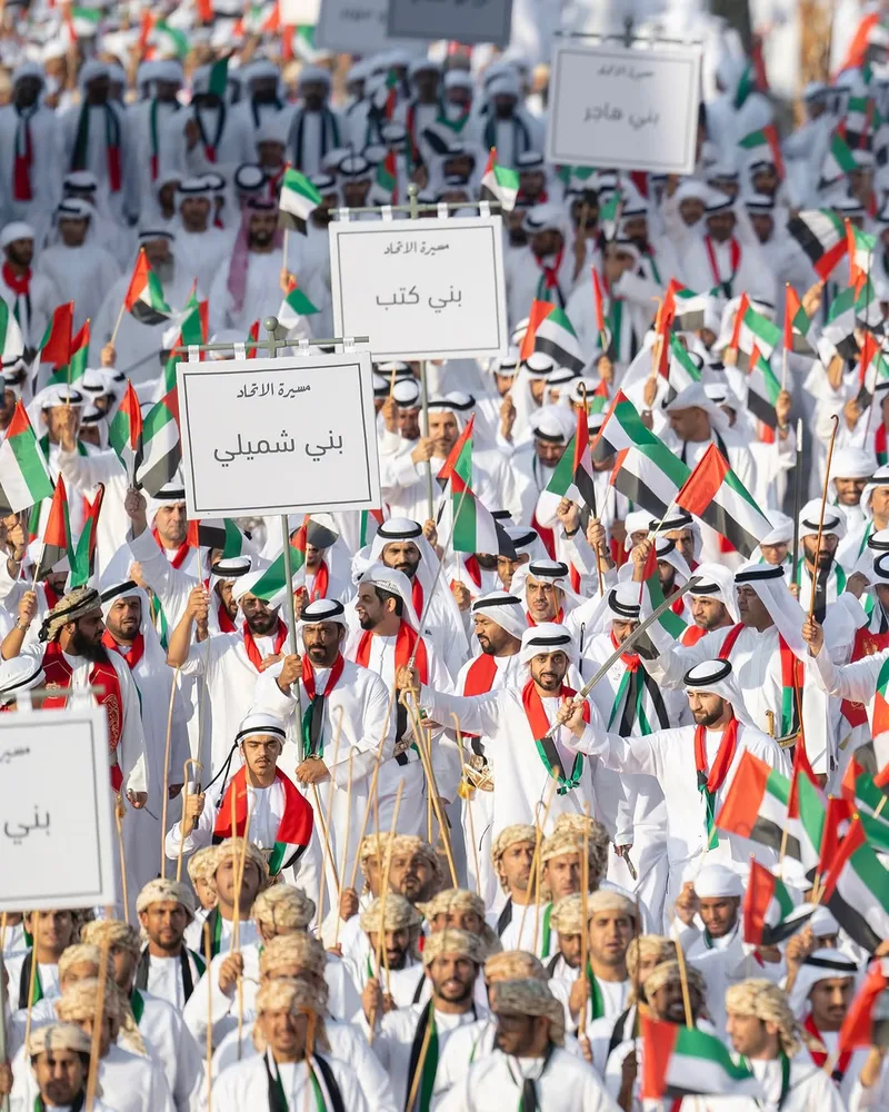 Large Union Parade 2025 crowd waving UAE flags during the national celebration in Abu Dhabi