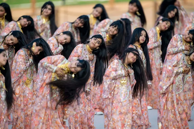 Female cultural performers taking part in Union Parade 2025 in Abu Dhabi during a traditional group performance