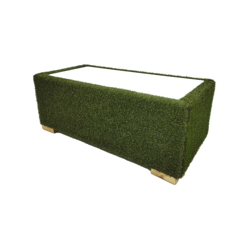 F-CT121-GS Eden coffee table finished in artificial grass with dark wooden feet and glass top