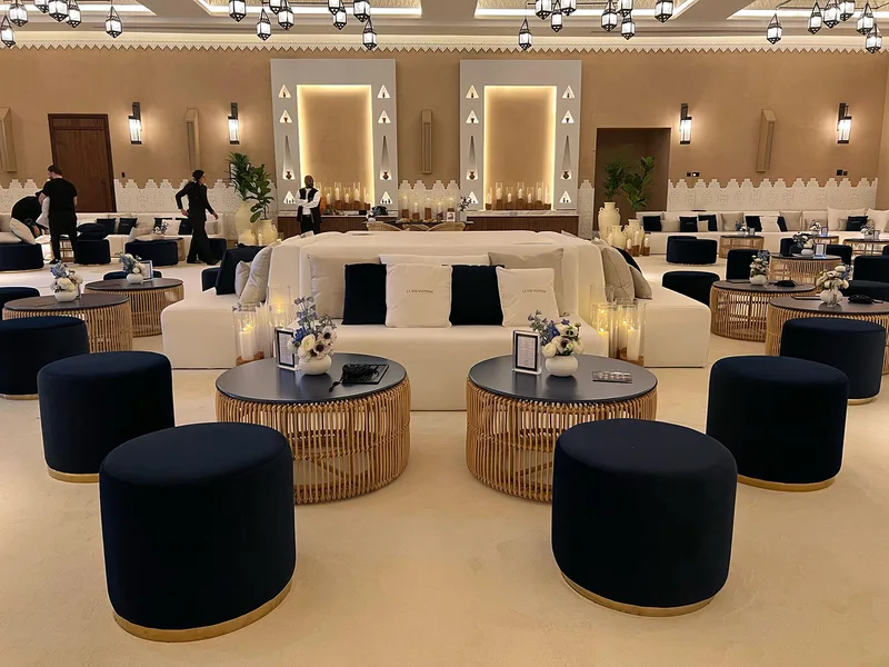 Styled hospitality lounge featuring decorative accessories and premium event furniture.