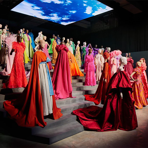 Tiered mannequin display featuring colourful Valentino garments within the M7 Doha exhibition.