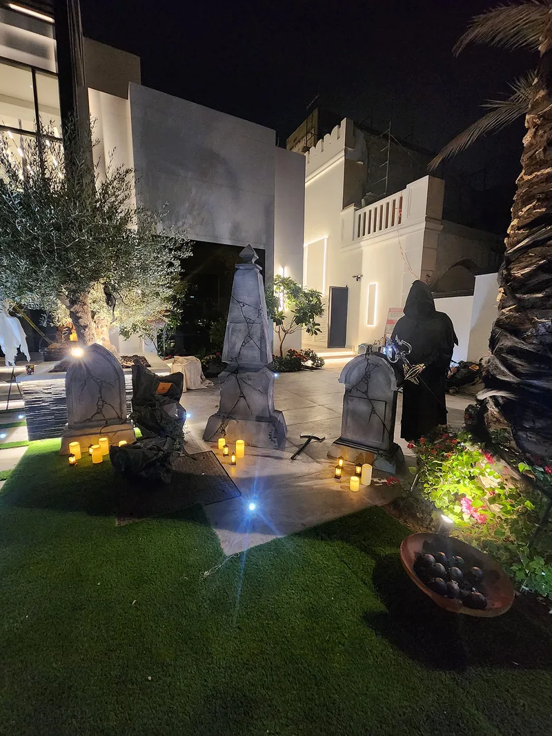Evolution Prop Shop Halloween graveyard props styled with lanterns and black decorative dressing