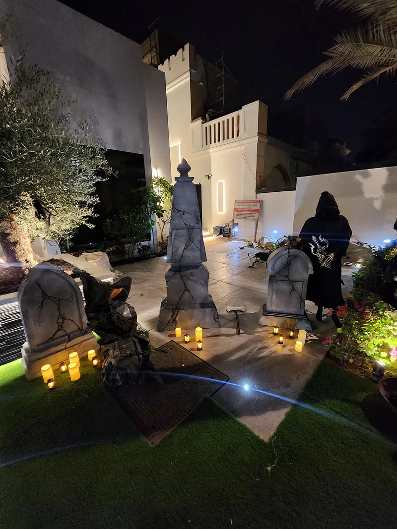 Evolution Prop Shop graveyard installation with distressed gravestones, monument and Grim Reaper