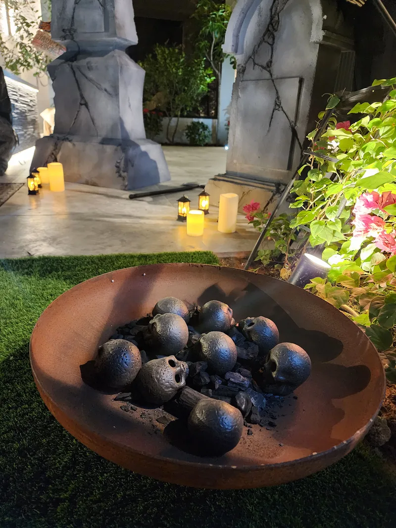 Graveyard props with cracked stone finishes, atmospheric candles and Grim Reaper styling