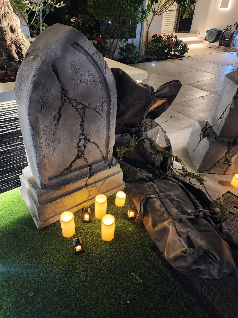 Evolution Prop Shop Jack-O-Lantern display with timber crates and illuminated Halloween candles