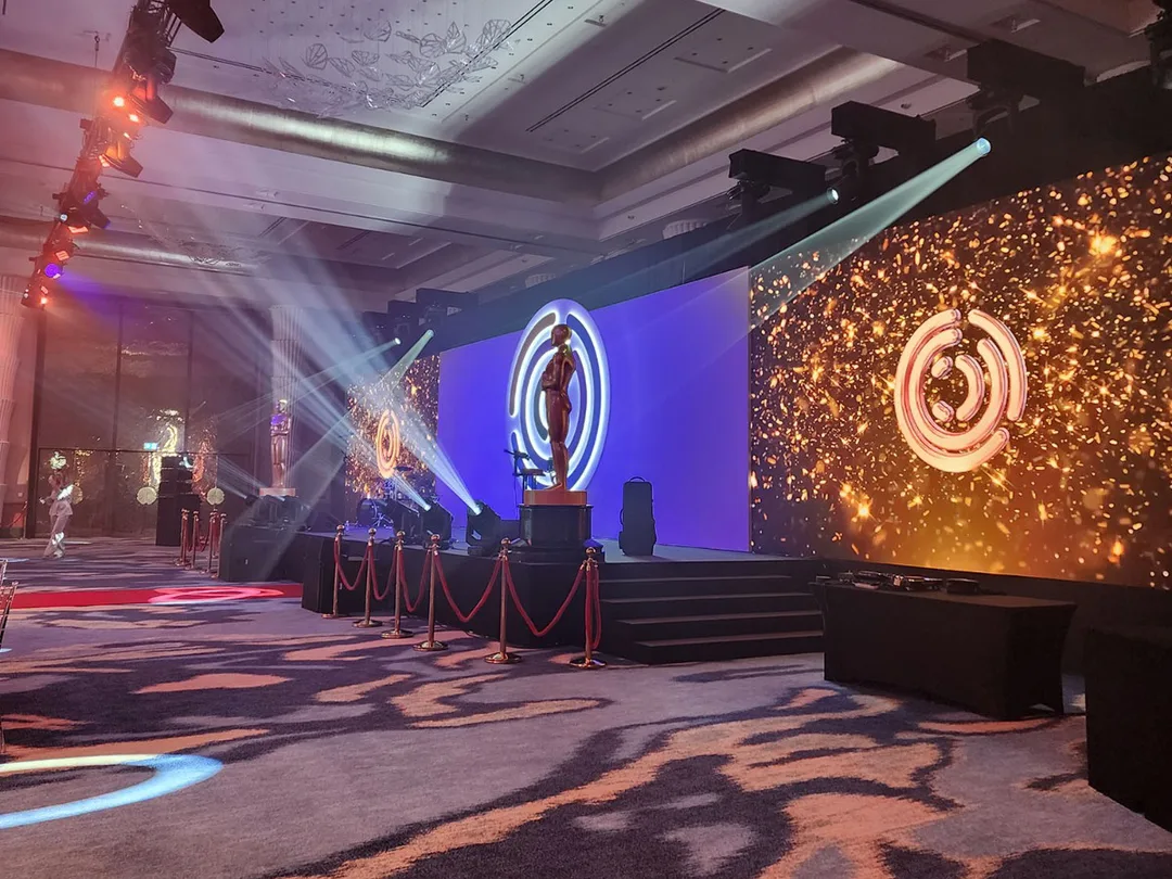 Awards-inspired sculptural stage figure supplied by Evolution Prop Shop for the Hollywood-themed ballroom.