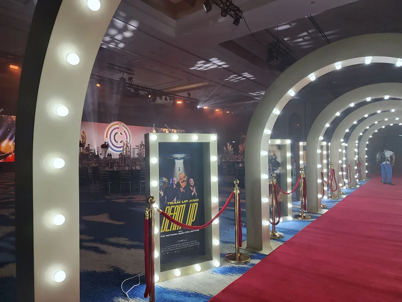 Evolution Prop Shop illuminated Hollywood arches creating a theatrical red carpet entrance at Atlantis Dubai.